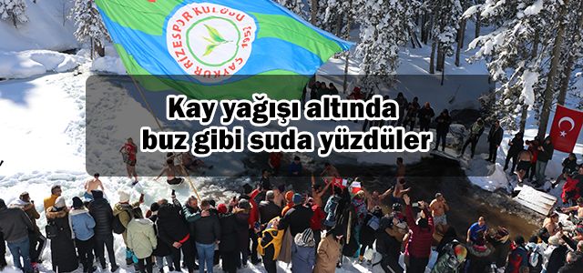 Kay yağışı altında buz gibi suda yüzdüler